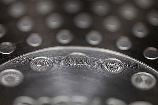 Символы на дне сковороды